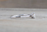 Under Hidden Halo Round Diamond Engagement Ring